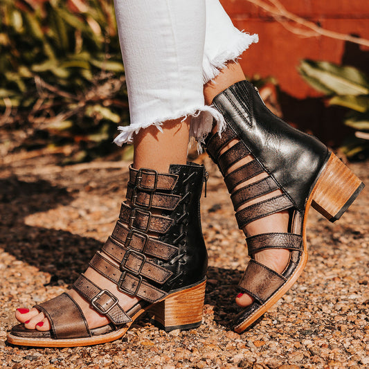 FREEBIRD women's Country black distressed leather sandal with adjustable leather straps, a working brass zipper and gore detailing