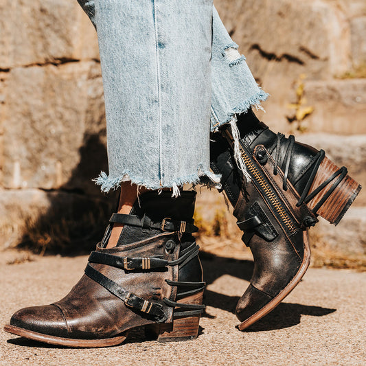 FREEBIRD women's Crue black distressed leather cutout ankle bootie with silver hardware straps and back lacing detail 