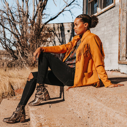 FREEBIRD women's Crue grey multi leather cutout ankle bootie with silver hardware straps and back lacing detail lifestyle image