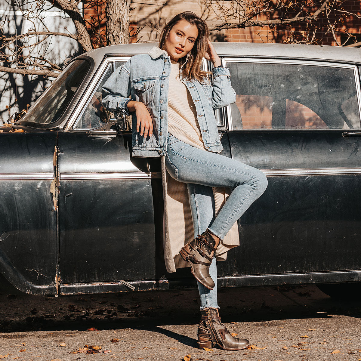 FREEBIRD women's Crue grey multi leather cutout ankle bootie with silver hardware straps and back lacing detail  lifestyle image