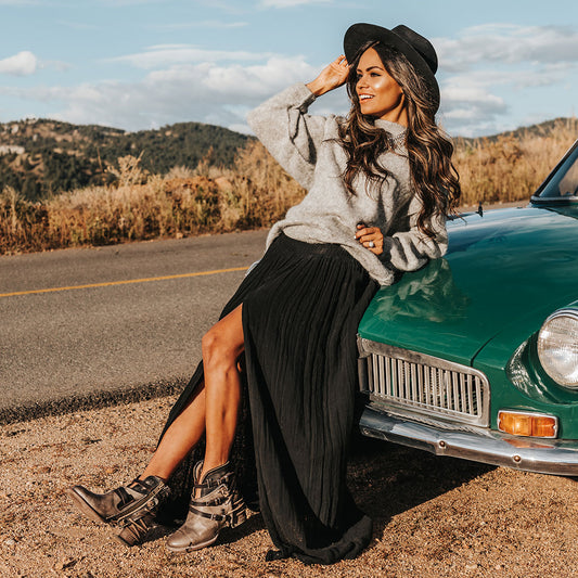 FREEBIRD women's Crue grey multi leather cutout ankle bootie with silver hardware straps and back lacing detail  lifestyle image