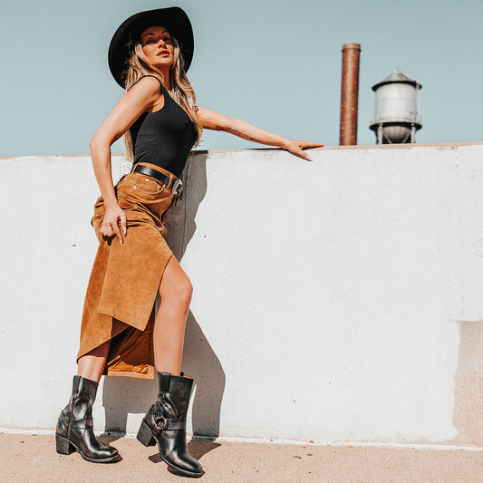 FREEBIRD women's Darcy black leather boot with a studded ankle harness, leather pull straps, an inside zip closure and a square toe lifestyle