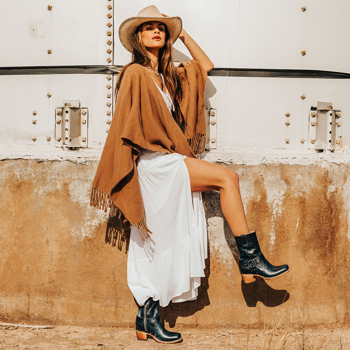 FREEBIRD women's Darcy blue leather boot with a studded ankle harness, leather pull straps, an inside zip closure and a square toe lifestyle image