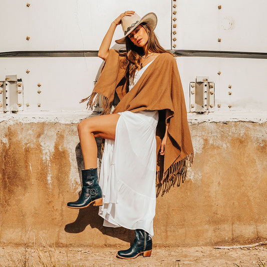 FREEBIRD women's Darcy blue leather boot with a studded ankle harness, leather pull straps, an inside zip closure and a square toe lifestyle image