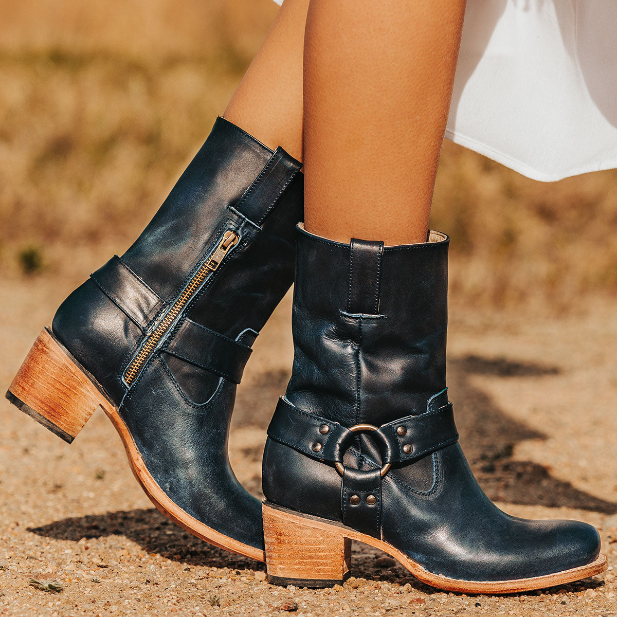 FREEBIRD women's Darcy blue leather boot with a studded ankle harness, leather pull straps, an inside zip closure and a square toe