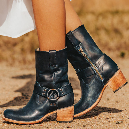 FREEBIRD women's Darcy blue leather boot with a studded ankle harness, leather pull straps, an inside zip closure and a square toe