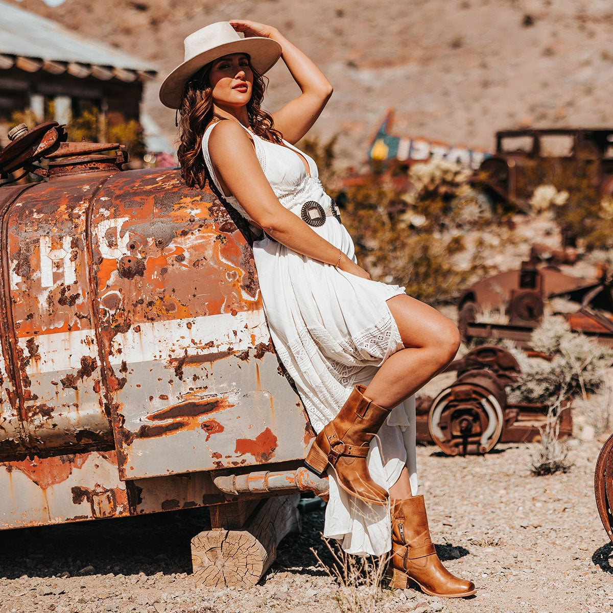 FREEBIRD women's Darcy wheat leather boot with a studded ankle harness, leather pull straps, an inside zip closure and a square toe lifestyle