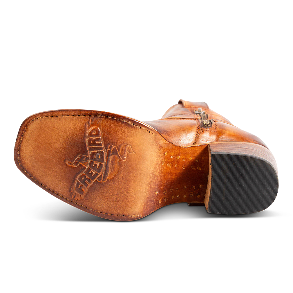 Leather sole imprinted with FREEBIRD on women's Darcy whiskey leather boot