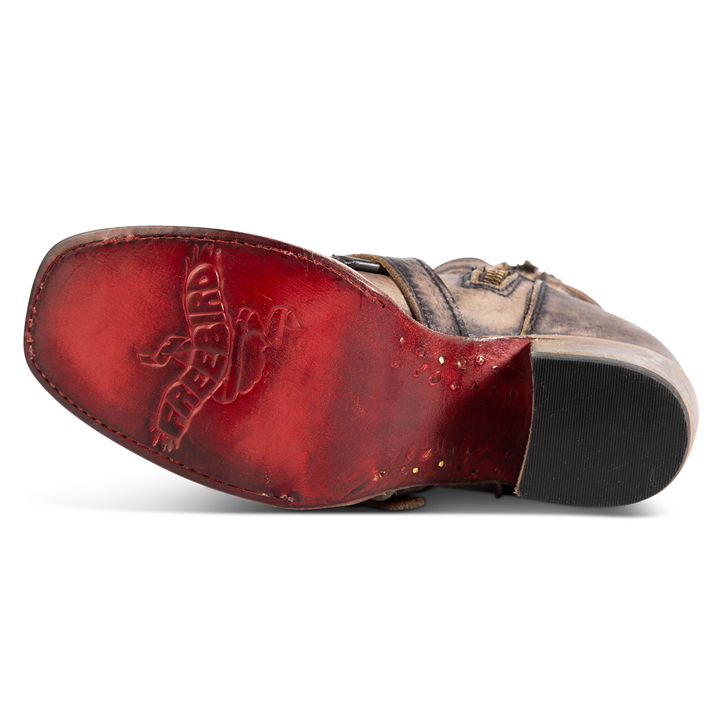 Red leather sole imprinted with FREEBIRD on women's Darlin black leather bootie