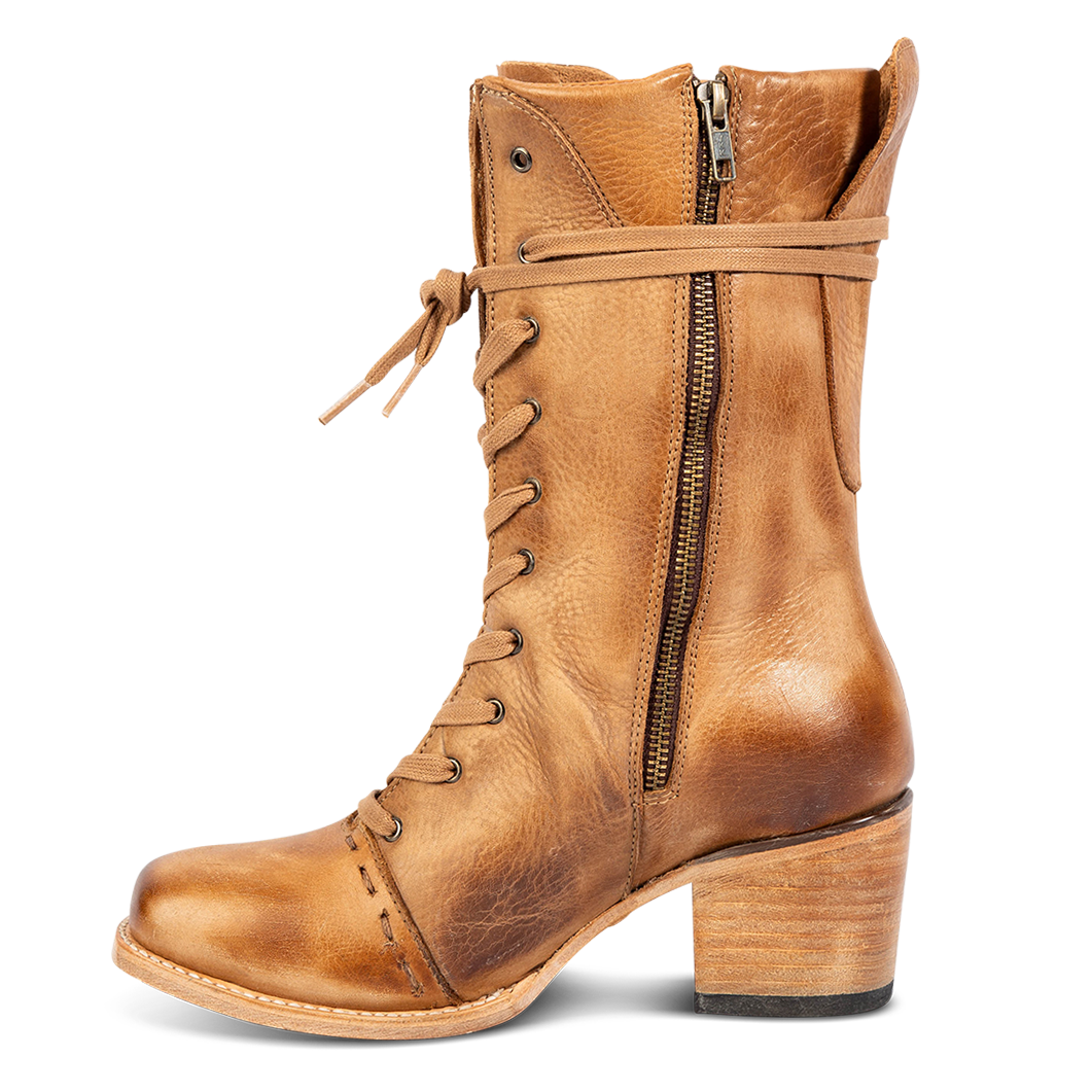Inside view showing working brass zip closure, front tie lacing and stacked heel on FREEBIRD women's Dart wheat leather boot
