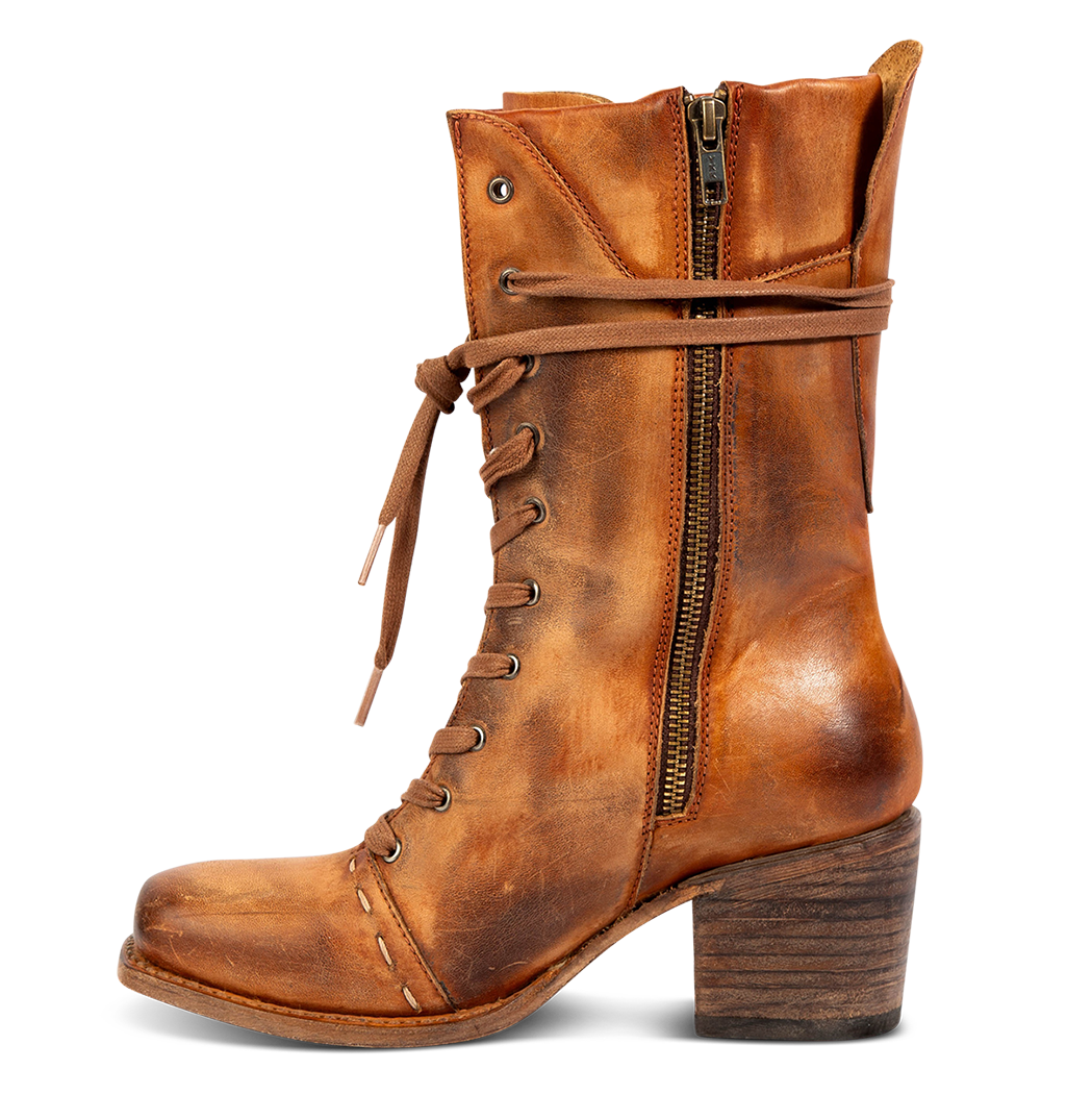 Inside view showing working brass zip closure, front tie lacing and stacked heel on FREEBIRD women's Dart whiskey leather boot