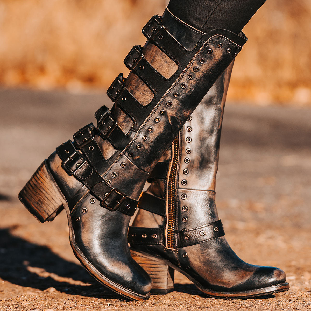 FREEBIRD women's Derby black leather boot with shaft buckle straps, eyelet studs and square toe construction