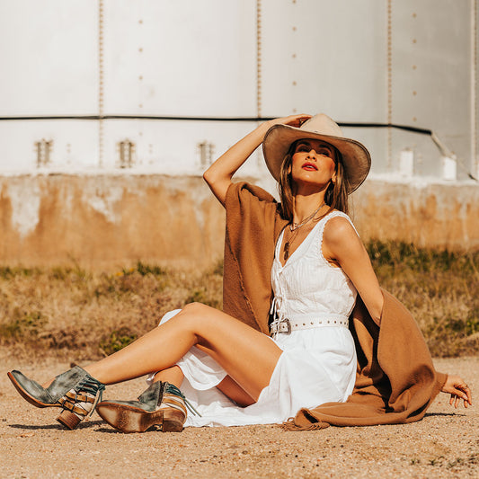 FREEBIRD Desert blue bootie with leather straps and working buckles lifestyle image