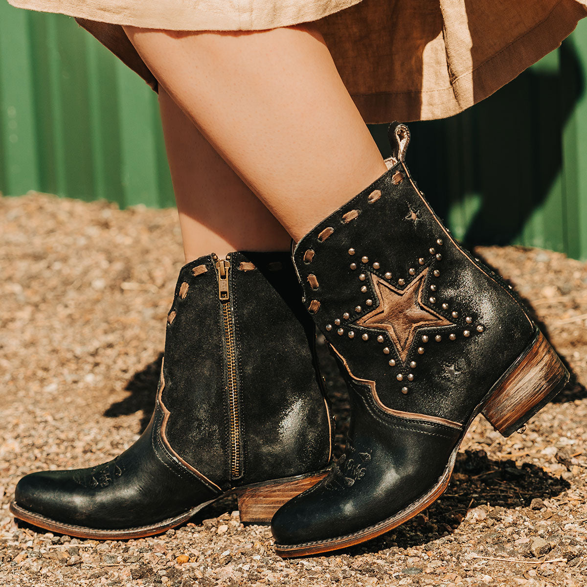 DOLLY Black Multi leather star booties with silver studs, contrast whipstitching, and low stacked heels.