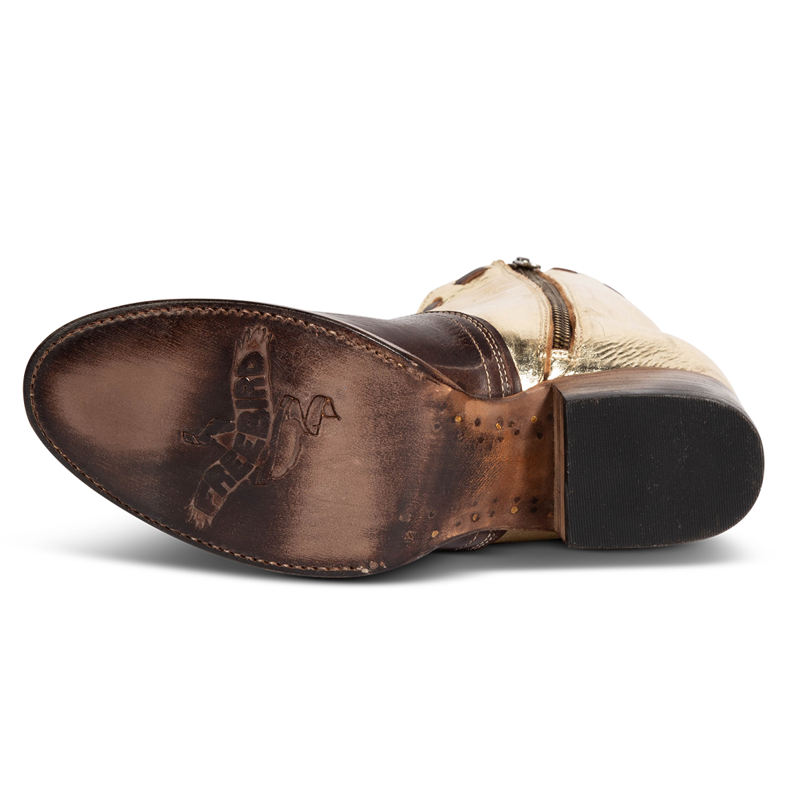 Leather sole imprinted with FREEBIRD on women's Dolly gold/brown multi low heeled bootie