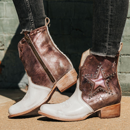 FREEBIRD women's Dolly pink multi star overlay bootie with silver stud detailing, contrasting whipstitching, almond toe, and inside zip closure