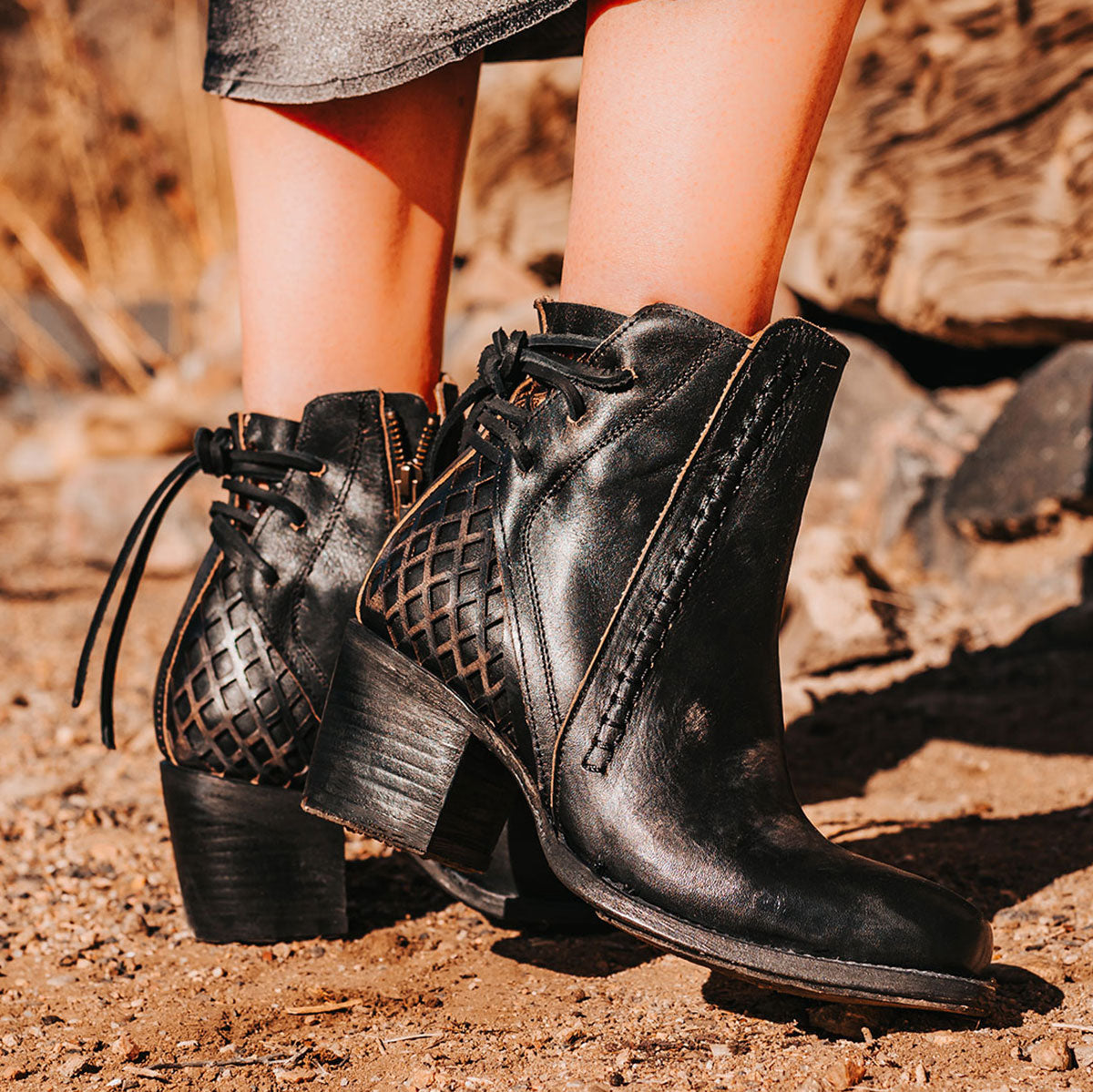 FREEBIRD women's Dreamer black leather bootie with laser cut detailing, leather tie back straps, a stacked heel and square toe lifestyle