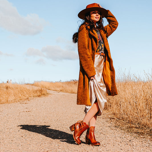 FREEBIRD women's Dreamer whiskey leather bootie with laser cut detailing, leather tie back straps, a stacked heel and square toe lifestyle