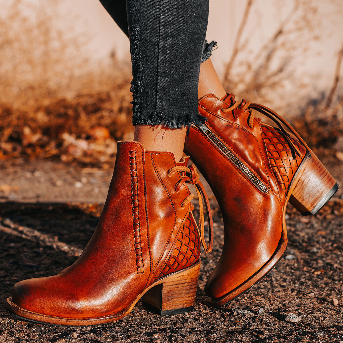 FREEBIRD women's Dreamer whiskey leather bootie with laser cut detailing, leather tie back straps, a stacked heel and square toe lifestyle