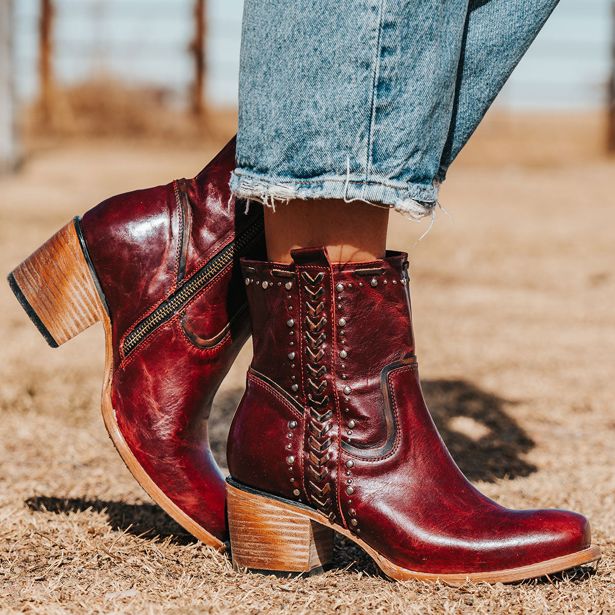 FREEBIRD Women's Duke red leather bootie with stud and whip stitch detailing, a full working inside zipper and square toe construction