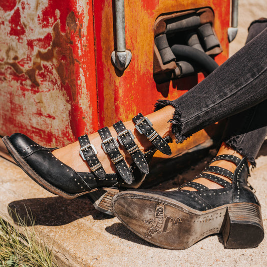 FREEBIRD women's Felicity black open construction adjustable strappy bootie with silver studded detailing and back zip closure