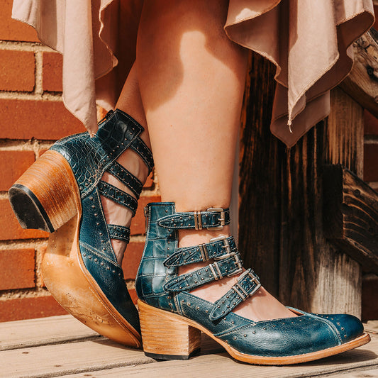 FREEBIRD women's Felicity blue multi open construction adjustable strappy bootie with silver studded detailing and back zip closure