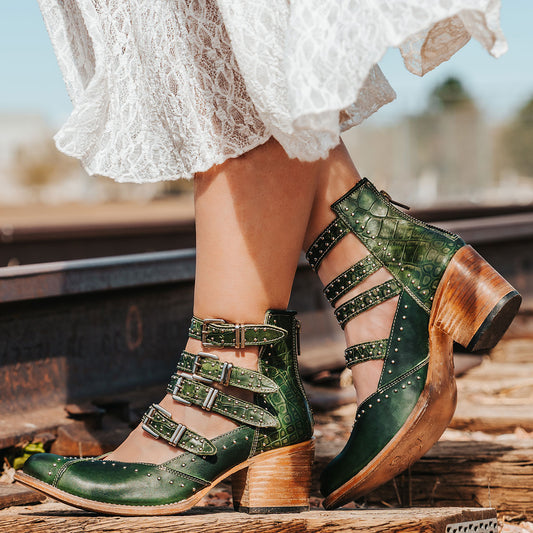 FREEBIRD women's Felicity green multi open construction adjustable strappy bootie with silver studded detailing and back zip closure