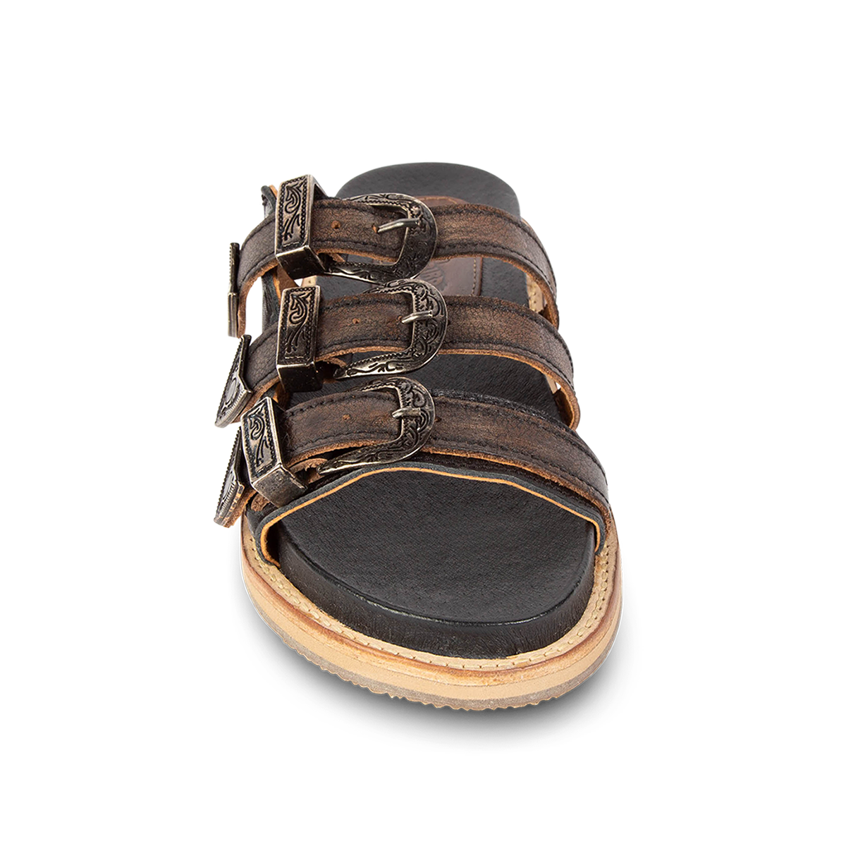 Front view showing adjustable buckles on FREEBIRD women's Franki black slip-on flat shoe featuring engraved metal detailing