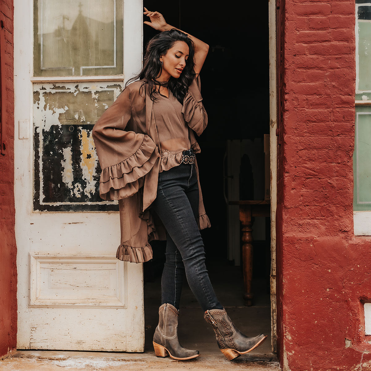 FREEBIRD women's Freya grey suede bootie with whip stitch detailing, a snip toe silhouette and decorative vintage buckle. Finished with an inside working zipper lifestyle