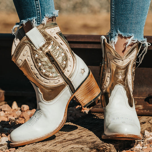 FREEBIRD women's Gambler gold multi leather bootie with an inside half zip closure, multi-leather elements and almond toe construction