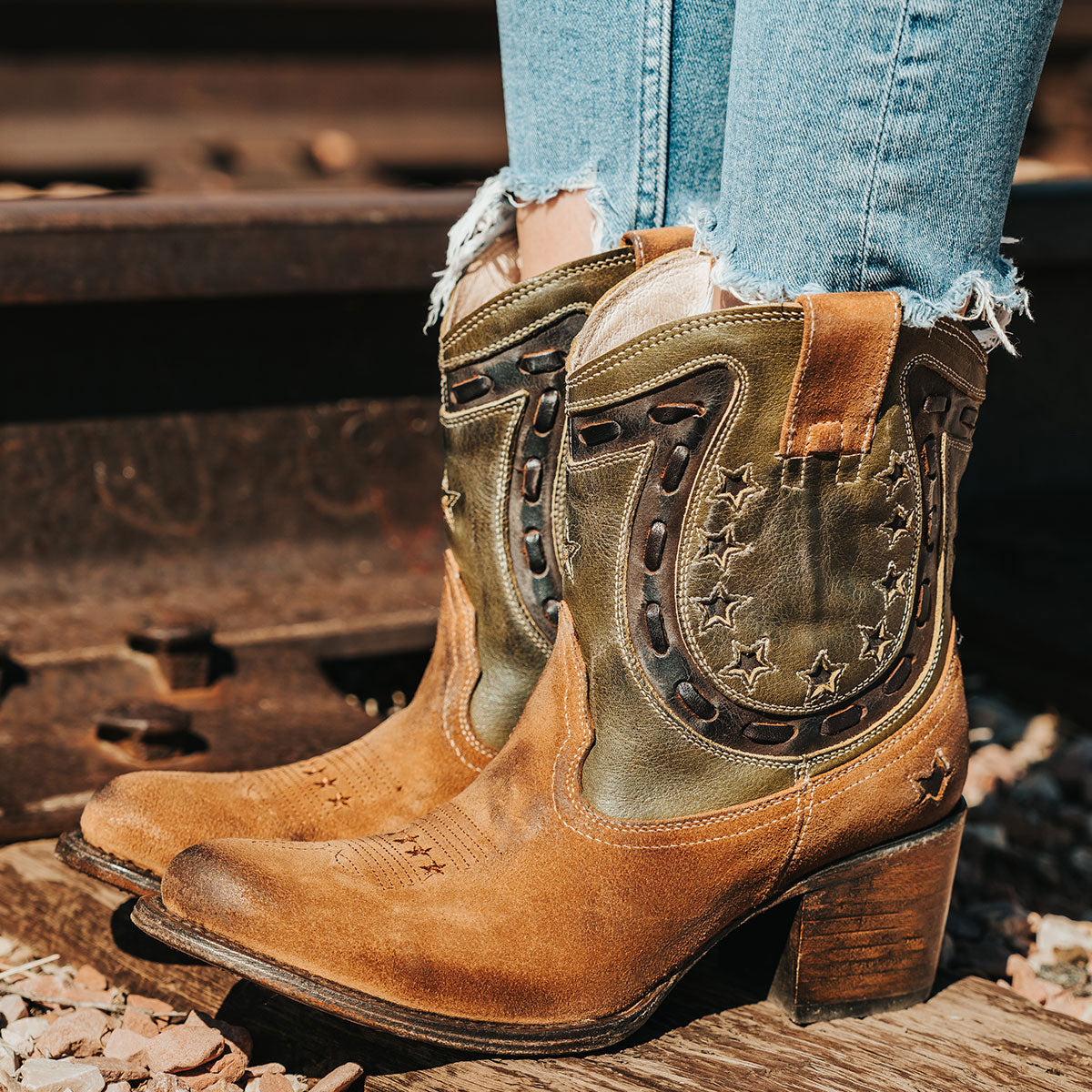 Tan Multi GAMBLER leather booties featuring a horseshoe overlay, side zippers, and low stacked heels.
