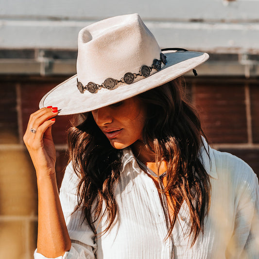 FREEBIRD Gemini beige wide flat-brim hat featuring diamond-shaped crown and metal coin band