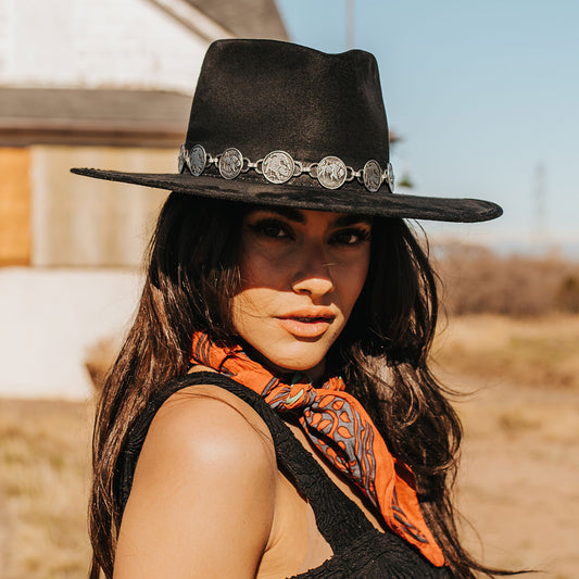 FREEBIRD Gemini black wide flat-brim hat featuring diamond-shaped crown and metal coin band lifestyle