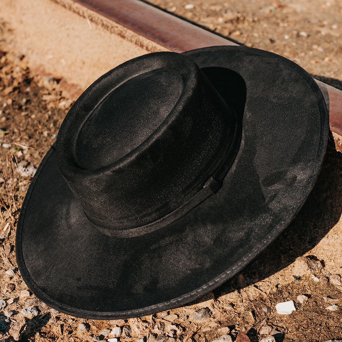FREEBIRD Georgia black flat wide-brim hat featuring telescope-shaped crown and tonal ribbon band