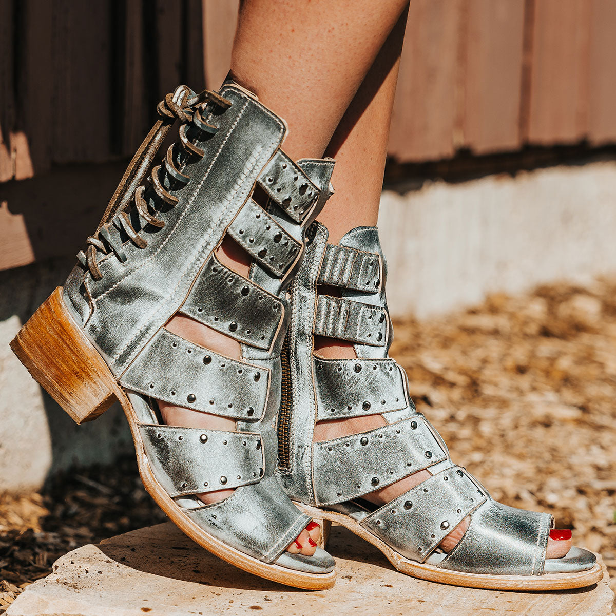 FREEBIRD women's Ghost ice sandal with an inside working brass zipper, back panel lacing and an exposed exterior