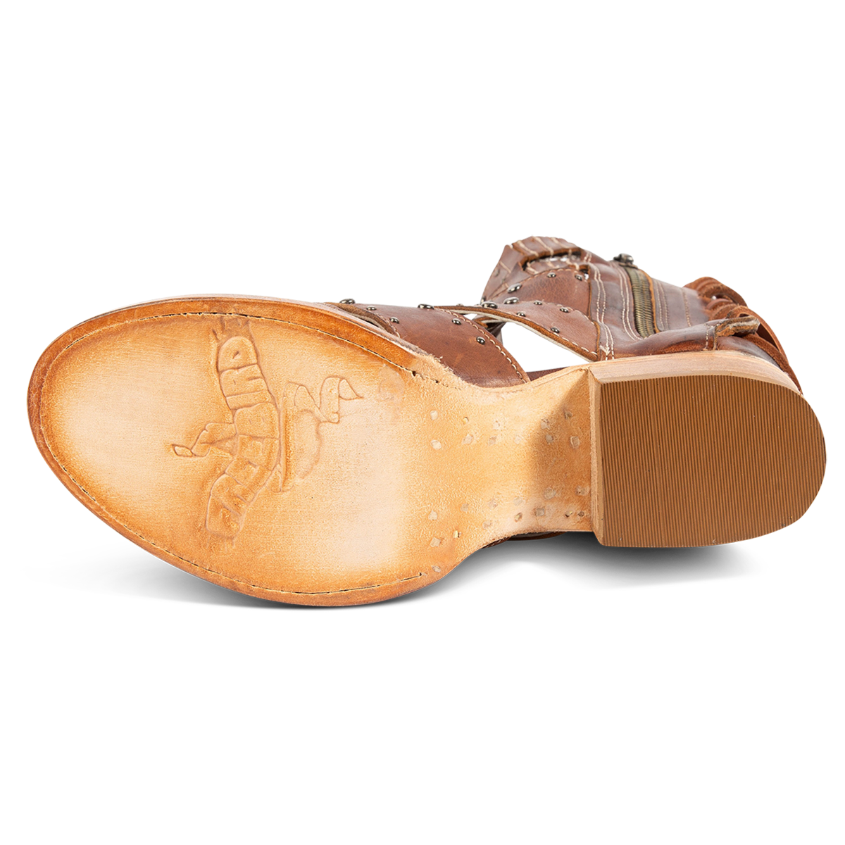Leather sole imprinted with FREEBIRD on women's Ghost tan leather sandal