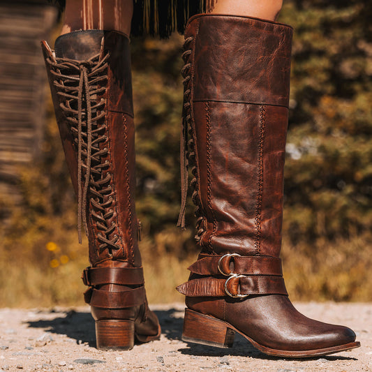 Freebird women's GIGI cognac knee high leather boot with adjustable back tie lacing, adjustable in-step belts and mid sized heel 