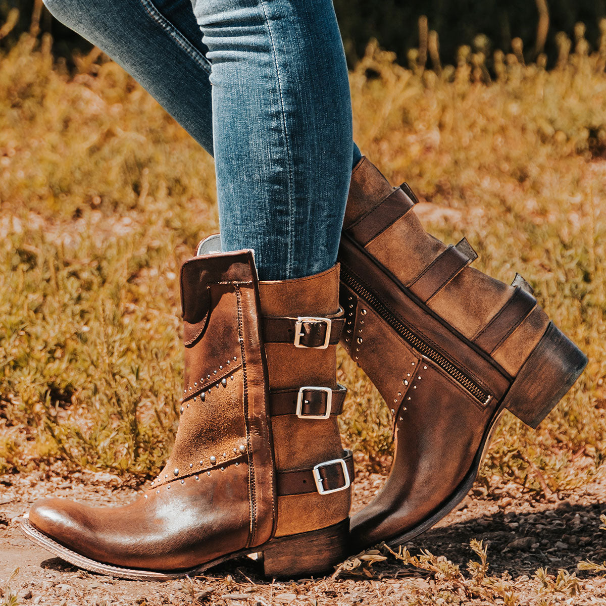 Freebird women's GOLDIE cognac suede and leather boot with stud embellishments, front shin cut out and adjustable buckle straps around the calf