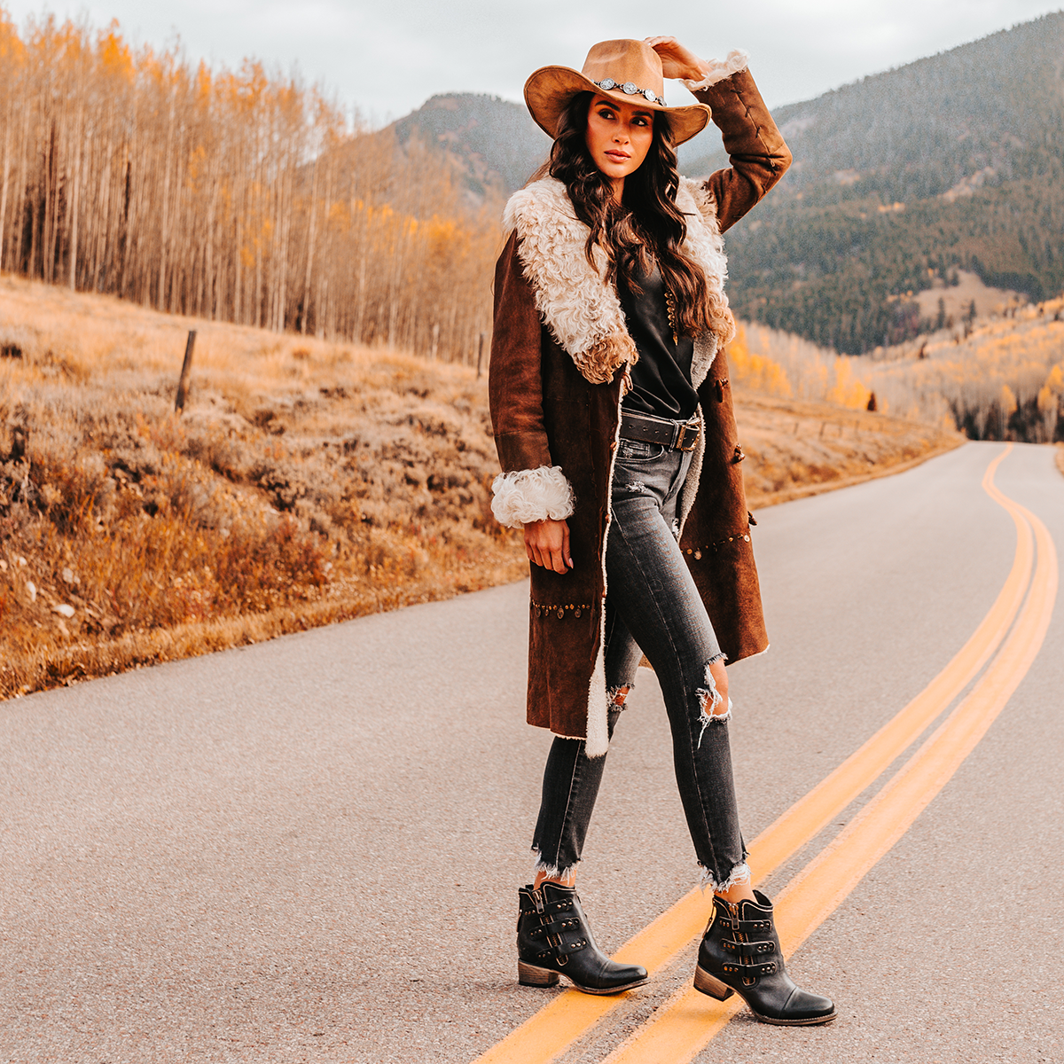 FREEBIRD women's Grecko black leather ankle bootie with studded symmetrical straps and heel brass zip closure lifestyle