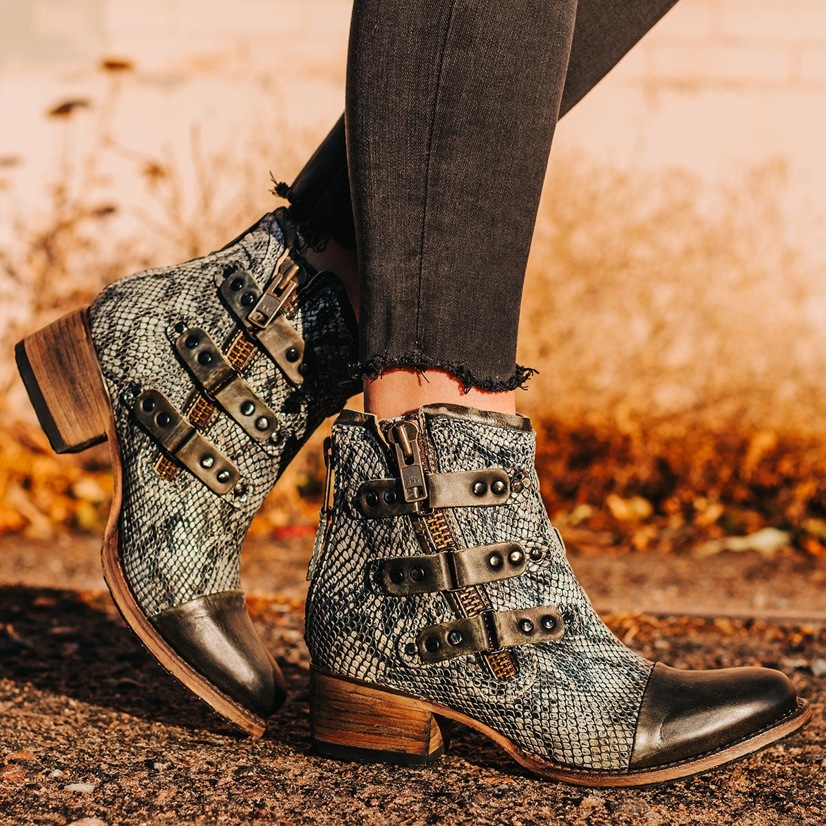 FREEBIRD women's Grecko olive leather ankle bootie with studded symmetrical straps and heel brass zip closure