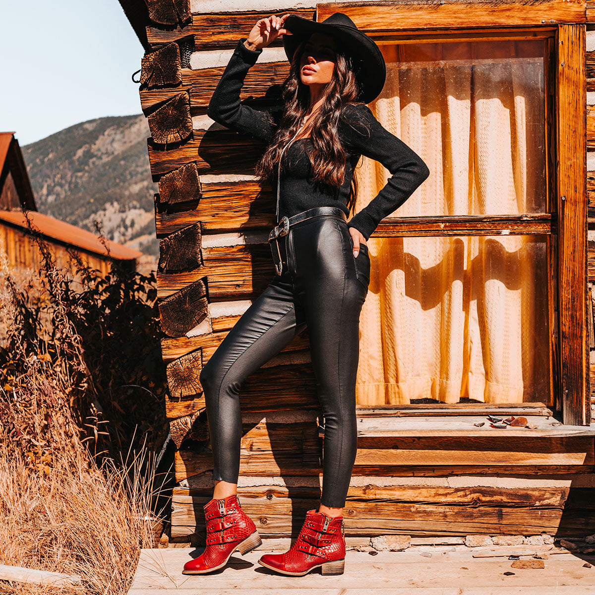 FREEBIRD women's Grecko red leather ankle bootie with low block heel and symmetrical studded straps lifestyle 
