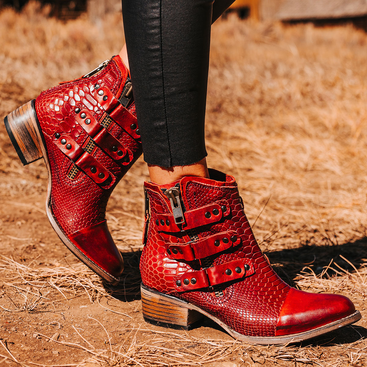 FREEBIRD women's Grecko red leather ankle bootie with studded symmetrical straps and heel brass zip closure