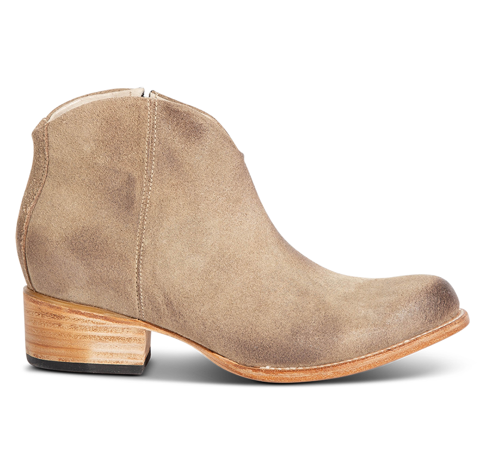 FREEBIRD women's Hippy beige suede low heeled bootie with a working brass zip closure, heel seam embroidery, almond toe, and front dip detailing