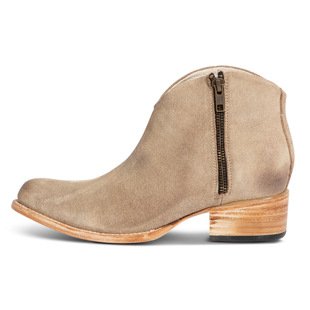 Inside view showing low leather wrapped heel and working brass zip closure on FREEBIRD women's Hippy beige suede bootie