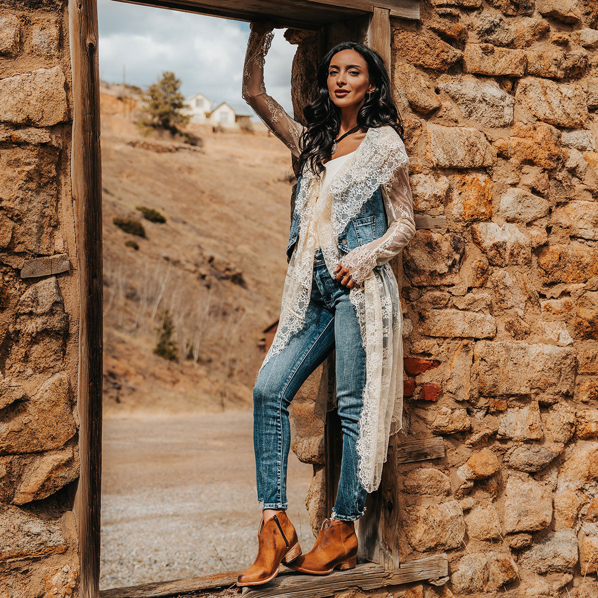 FREEBIRD women's Hippy cognac suede low heeled bootie with a working brass zip closure, heel seam embroidery, almond toe, and front dip detailing lifestyle