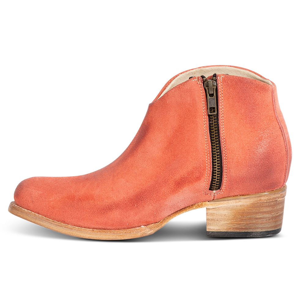Inside view showing low leather wrapped heel and working brass zip closure on FREEBIRD women's Hippy pink suede bootie