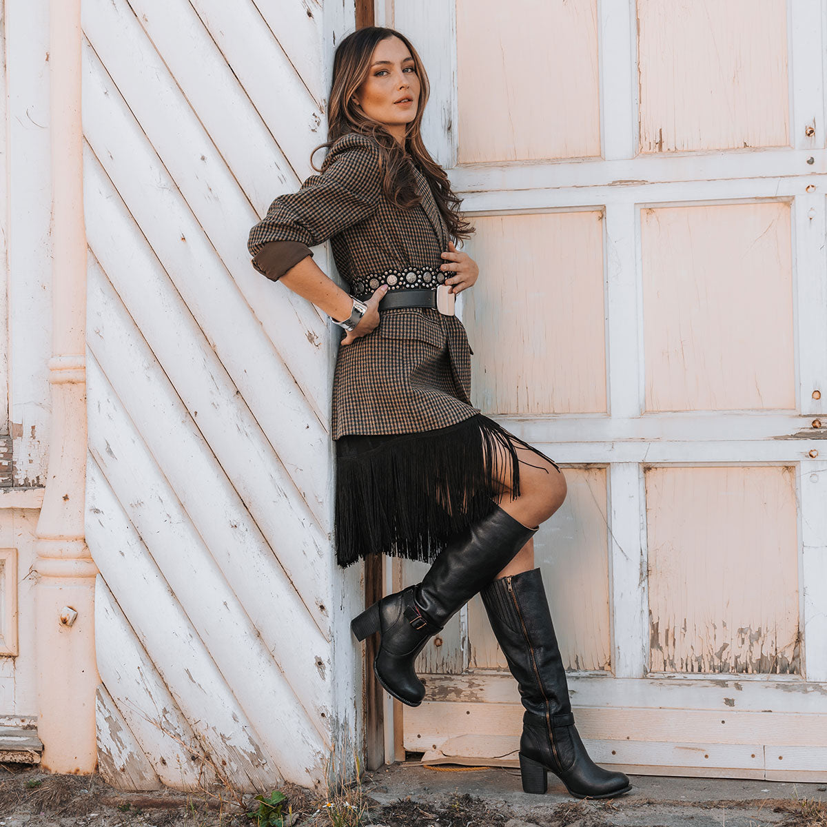 Freebird women's HOLLAND black leather tall boot with a full inside brass zipper, in-step adjustable belt and bold high heel lifestyle
