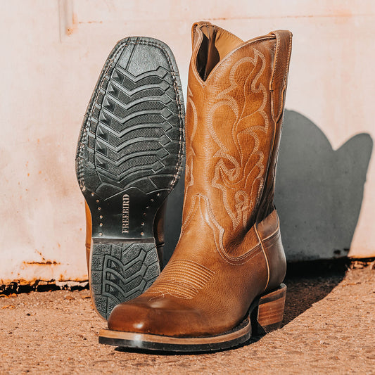 FREEBIRD men's James banana leather boot with traditional Western stitching, tread sole and leather pull straps 
