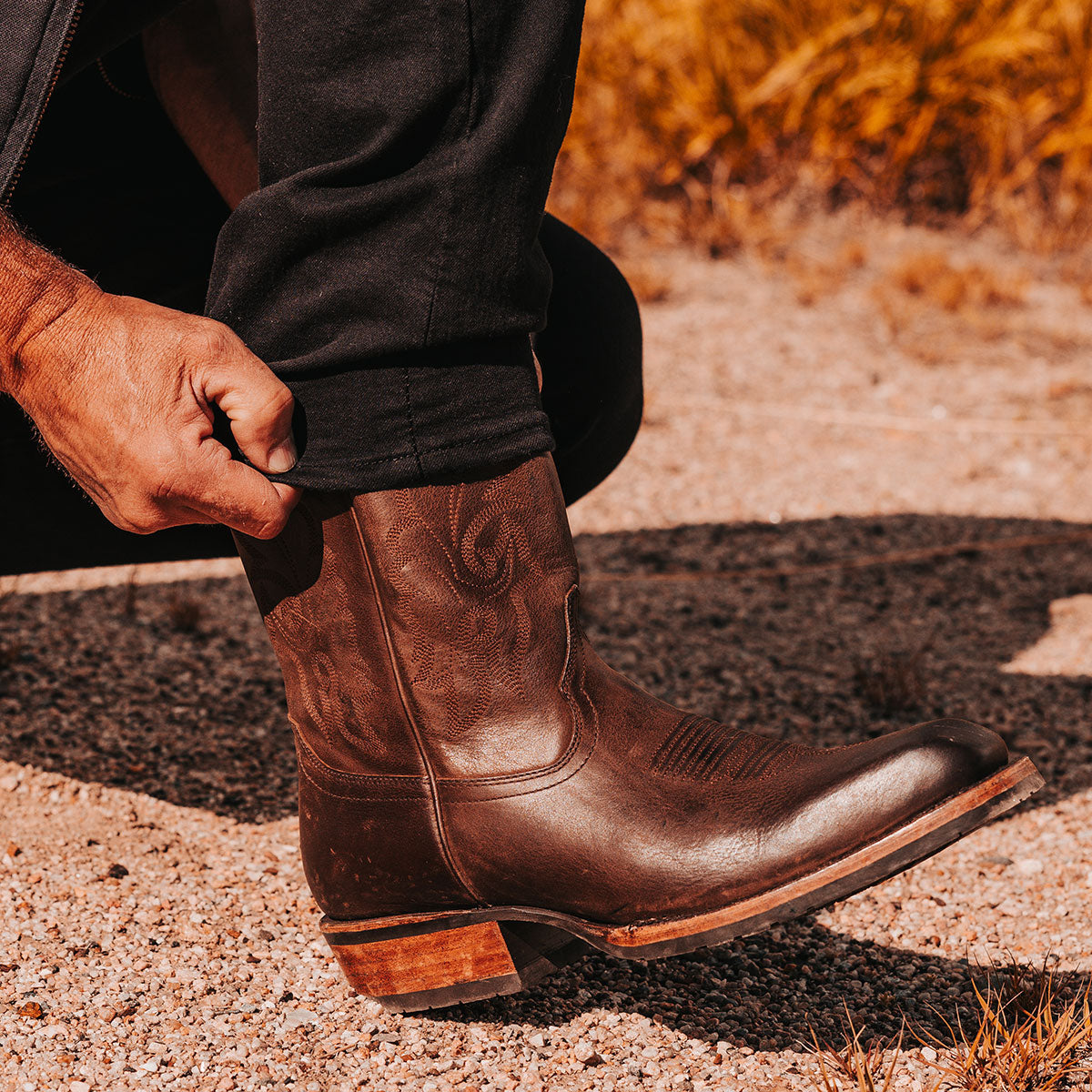 FREEBIRD men's James brown leather boot with traditional Western stitching, tread sole and leather pull straps