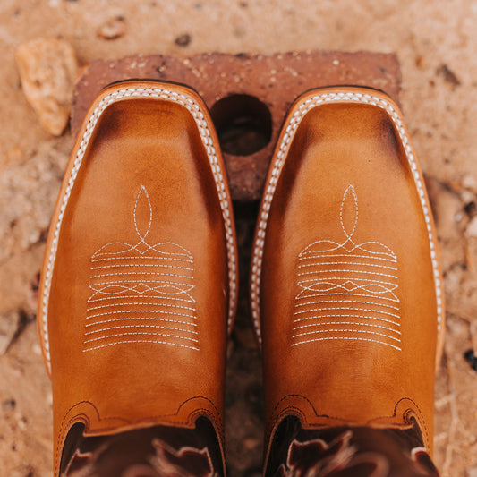 FREEBIRD men's James tan multi leather boot with traditional Western stitching, tread sole and leather pull straps 